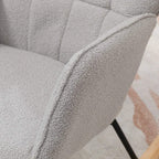 Light grey upholstered armrest and wingback backrest on a rocking chair