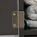 Dark brown cabinet door hinge with gold screws, close-up detail