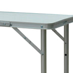 Silver foldable picnic table with rounded corners and cross-brace folding frame