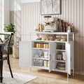 White sideboard with open shelf and double cabinet doors; shelves and baskets inside