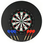 Black bristle dartboard with steel-tip darts laid in front