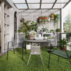 Grey round patio dining table with slatted top and woven base on metal legs