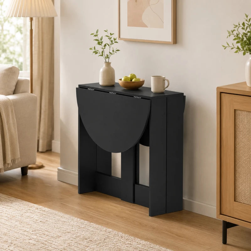 Black round drop-leaf folding dining table with side panels opened and tabletop expanded