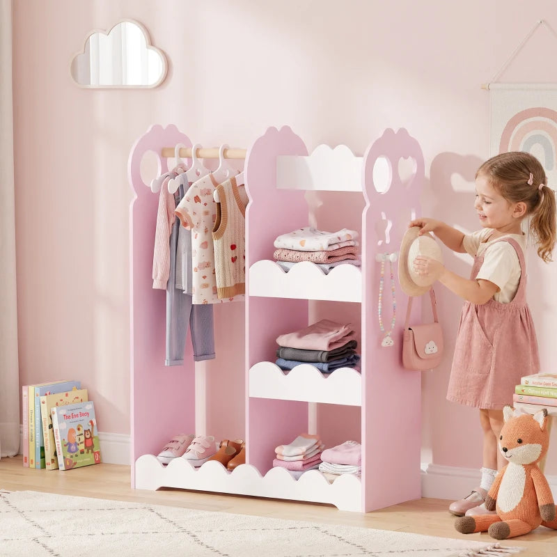 Kids pink dress-up wardrobe with built-in mirror, hanging rail, and open shelves