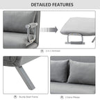 Light grey sofa bed detail with fold-down mechanism and two extra pillows