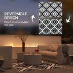 Reversible outdoor rug in black-and-white geometric diamond pattern with LED string lights