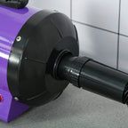Close-up of purple pet dryer blower front outlet and black ribbed hose connector