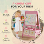 Pink kids art easel with whiteboard and storage drawers, used by a child