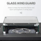 Black square fire pit table with open glass wind guard and lava-rock burner base
