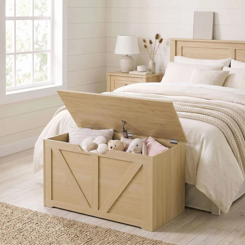 Wooden storage box beside a bed with open lid and stuffed toys inside