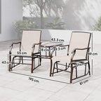 Outdoor gliding lounge chairs with beige seats and dark frames, set with glass-top middle table
