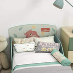 Green toddler bed frame with bear-themed headboard panel and slatted mattress base