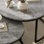 Close-up of grey marble-effect round tabletop edge on black nesting table frame