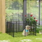 Black metal dog playpen with wire-bar sides and small dog inside on outdoor grass