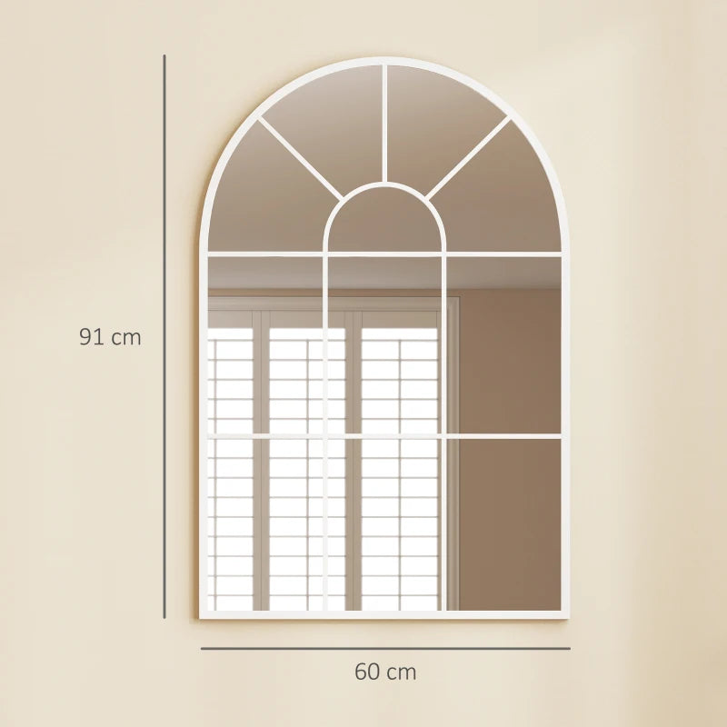 White arched grid mirror mounted on wall with window-style pane grid