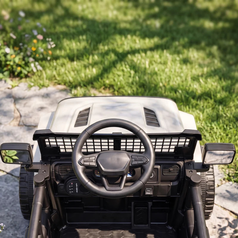 White kids electric ride-on car dashboard close-up with steering wheel and grille