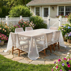 White waterproof mesh tarpaulin draped over patio dining set with hanging edges