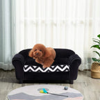 Black pet sofa bed with chevron cushion, shown with a small dog resting on it