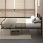 Black metal bed frame with headboard and footboard, slatted base and bedding