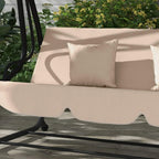 Close-up of light-brown swing chair seat with two beige throw pillows
