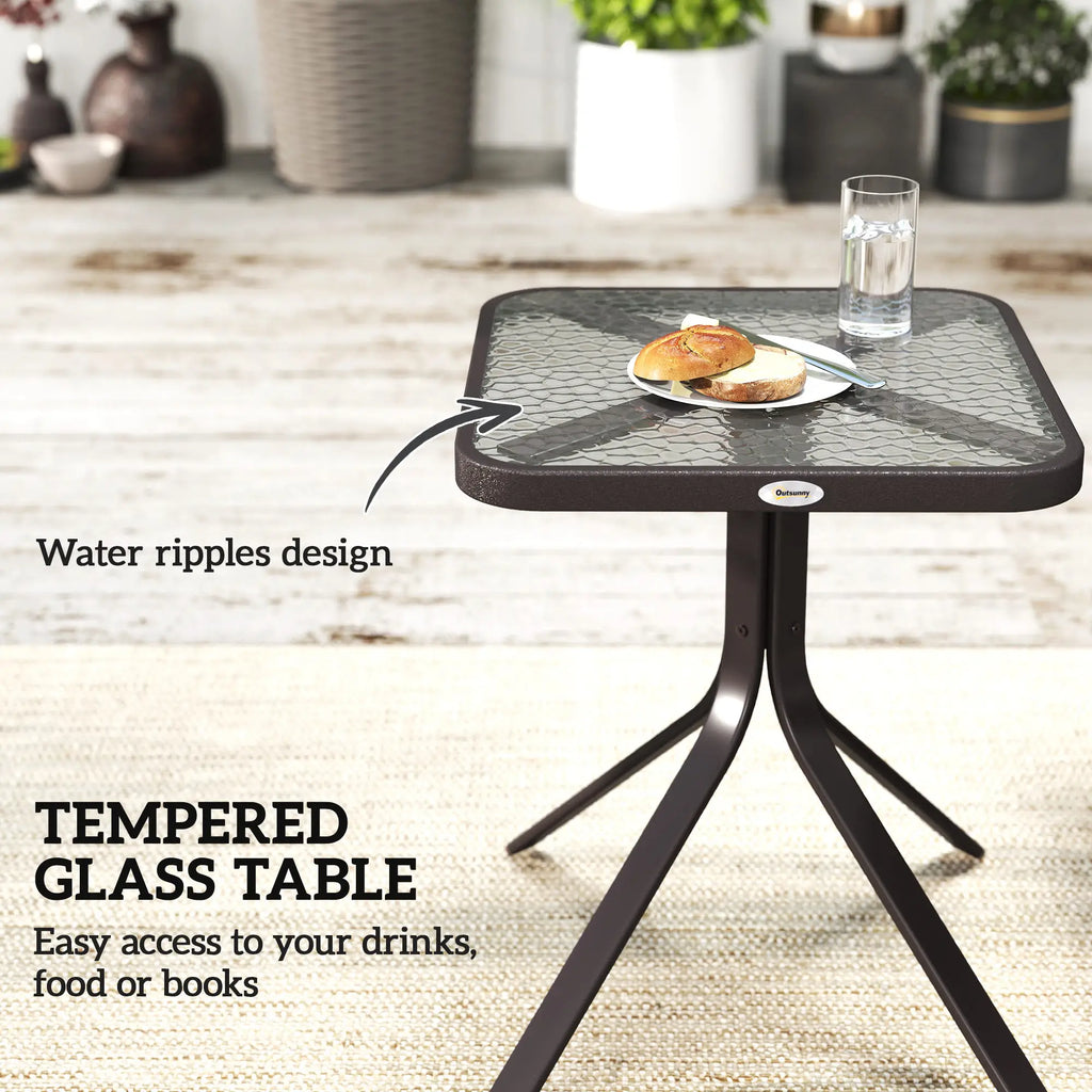 Tempered glass patio table with a rippled surface and dark metal base