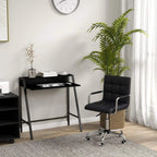 Black faux leather home office chair with swivel casters beside black desk with shelf