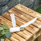 Close-up of slatted wooden bench seat with knots and metal screws