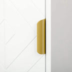 Gold door handle on white bathroom cabinet with textured geometric door panel
