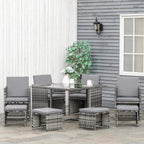 Grey rattan dining set with table and eight chairs, seat cushions included