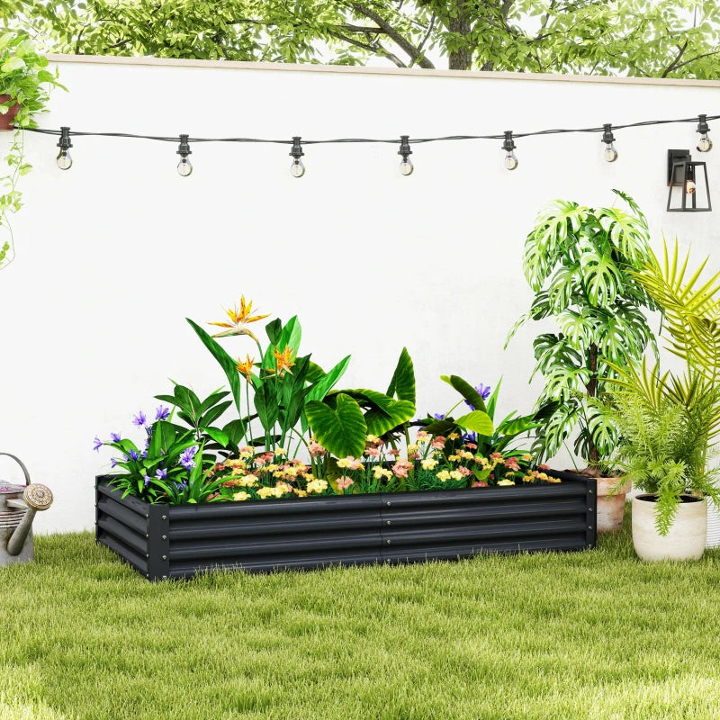 Dark grey galvanised steel planter with mixed plants and colorful flowers