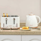 Cream-white electric kettle and 4-slice toaster set with rose-gold accents on countertop