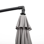 Black cantilever umbrella top clamp with light grey hanging canopy cover