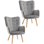 Pair of grey wingback accent chairs with tufted panels and light wood legs
