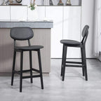Pair of black wooden bar stools with faux-leather seats and upright backrests