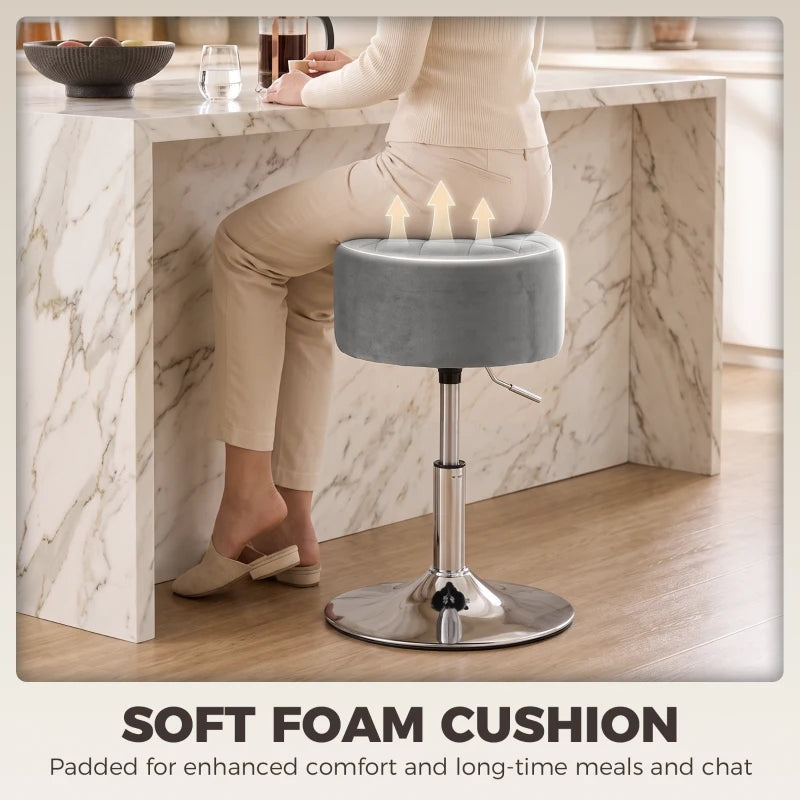 Grey round bar stool with padded seat cushion and chrome height-adjustable base