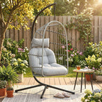 Light grey hanging egg chair with wire shell, padded cushion, and hanging chain