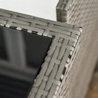 Close-up of grey woven rattan frame with dark glass tabletop edge