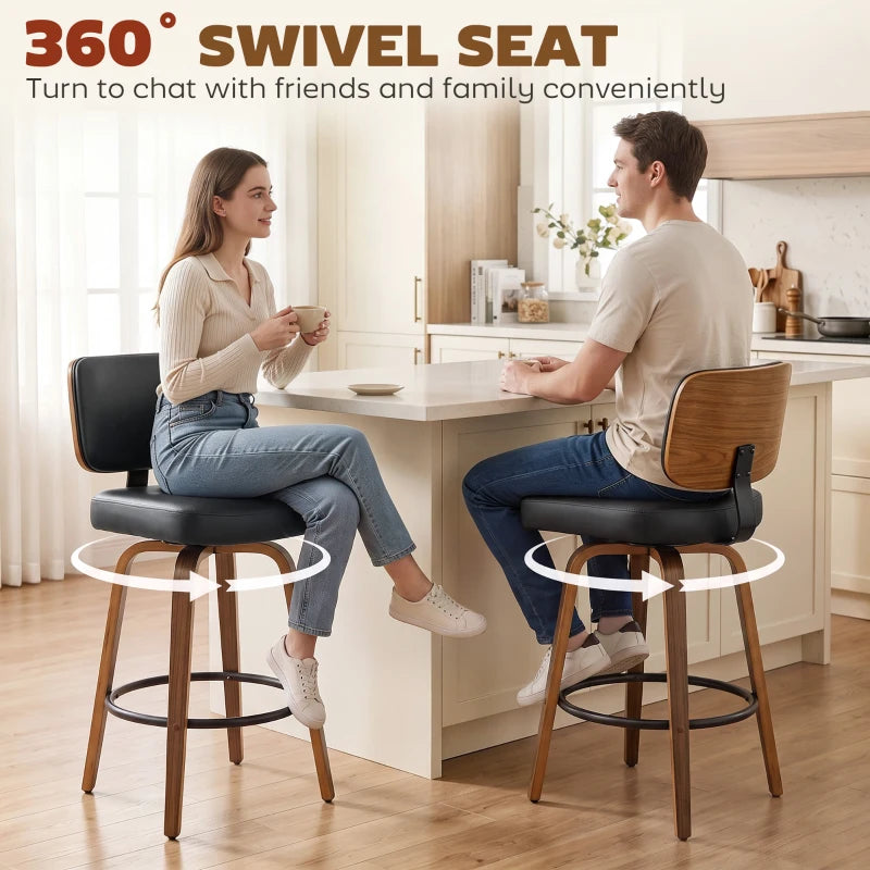 Set of 2 black swivel bar stools with padded seats, curved backs, and round footrests