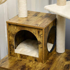 Rustic brown wooden cat house with rounded entrance and built-in cushioned bed