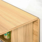 Teak table edge close-up with drop-leaf panel and side storage opening