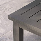 Outdoor coffee table corner with slatted tabletop and dark aluminum legs