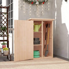 Natural wood garden tool shed with open door revealing shelving and stored yard tools