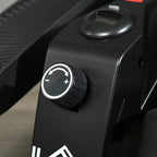 Resistance adjustment knob with plus and minus markings on elliptical cross trainer