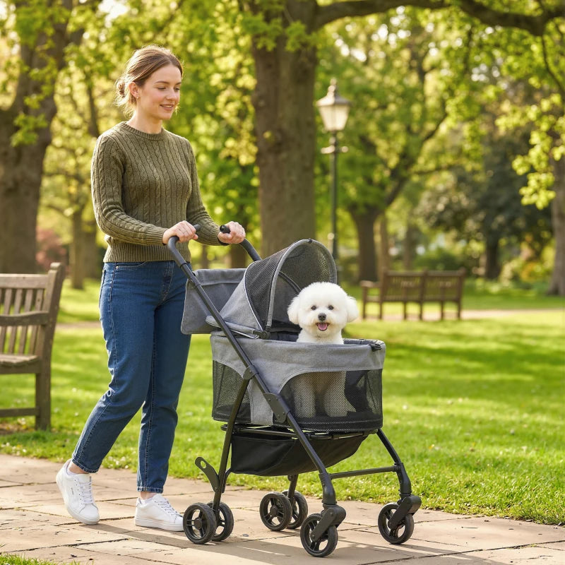Grey foldable pet stroller with mesh sides, canopy, and a dog inside