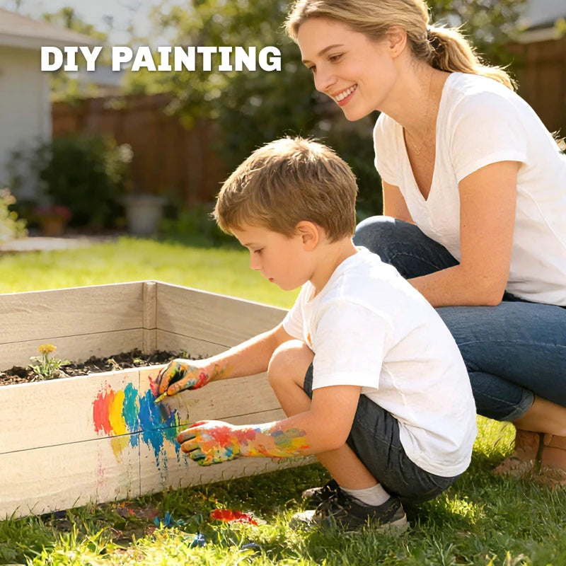 Child painting a wooden raised garden bed in a backyard