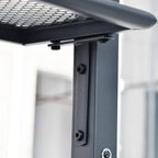 Grey metal gazebo frame corner joint with bolts under the double-tier roof