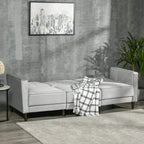 Light grey velvet corner sofa bed with chaise ottoman and plaid throw blanket