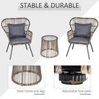 Rattan bistro set with two chairs, round glass-top table, and steel frame legs