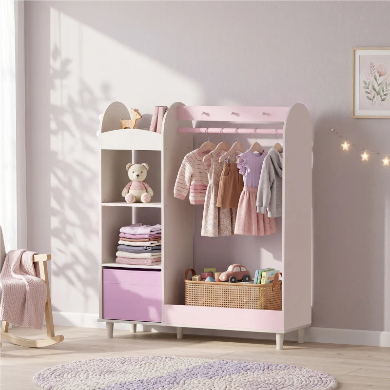 Pink kids clothing wardrobe with mirror, open shelves, and hanging rail for outfits.