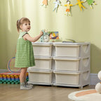 Cream kids storage unit with six drawers and rounded cutout handles, next to a child.